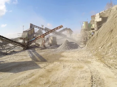 Machines work on a huge quarry for the extraction of stone Stock Footage 73198994