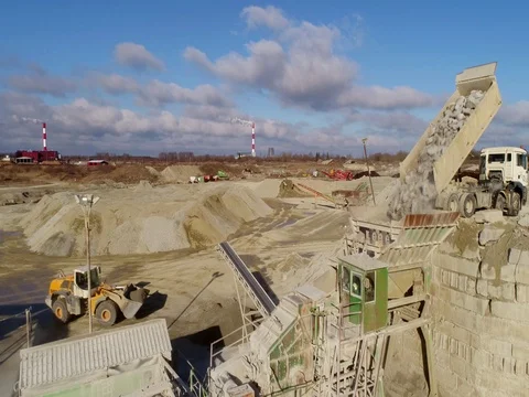 Machines work on a huge quarry for the extraction of stone Stock Footage 73227595