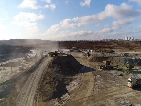 Machines work on a huge quarry for the extraction of stone Stock Footage 73229795