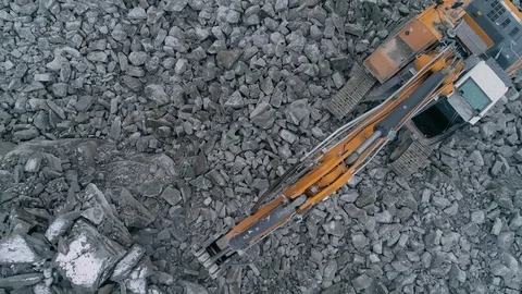 Machines work on a huge quarry for the extraction of stone Stock Footage 99791668