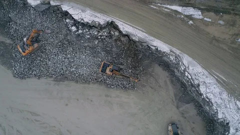 Machines work on a huge quarry for the extraction of stone Stock Footage 99791820