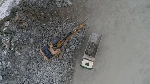 Machines work on a huge quarry for the extraction of stone Stock Footage 99792961