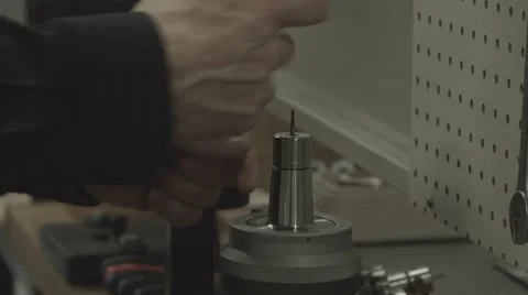 Machinist Assembles Tool Bit for CNC Machine Stock Footage 62926827