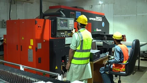 Machinist Programming A Automated Program For A CNC Machine To Mill Steel Stock Footage 332368464