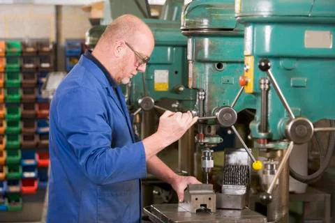 Machinist working on machine Foto stock