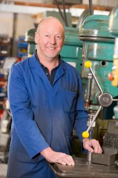 Machinist working on machine Stock Photos
