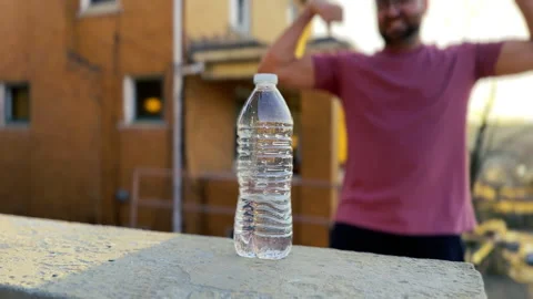 Macho Man Performs A Water Bottle Flip Trick Stock Footage 268466719