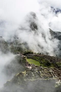 Machu Picchu in the clouds Stock Photos