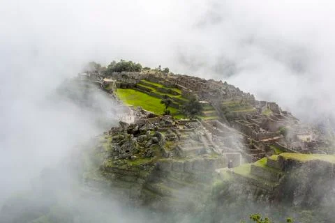 Machu Picchu in the clouds Stock Photos
