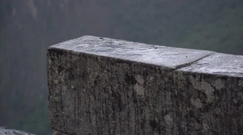 Machu Picchu, Peru: close-up of rain splattering on a stone wall Stock Footage 59535631