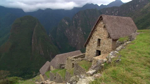 Machu Picchu, Peru: Pan from thatched roofs to Eastern Urban Center Stock Footage 59535567