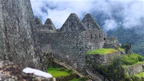 Machu Picchu stone work terraces tourist circuit sunny blue sky clouds morning Stock Footage 326034831