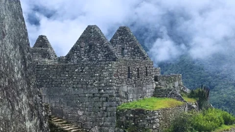 Machu Picchu stone work terraces tourist circuit sunny blue sky clouds morning Stock Footage 326034950