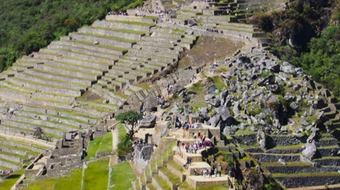 Machu Picchu wide angle in time lapse showing people on terraces and ruins Stock Footage 33831306
