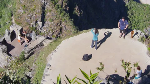 Machu Picchu wide angle in time lapse at distance as people look at it from afar Video stock 33831645