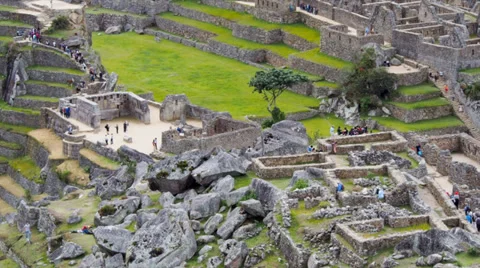 Machu Picchu wide angle in time lapse showing people moving around in ruins Stock Footage 33832350