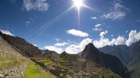Machu Picchu wide angle in time lapse with clouds and looking into Sun Stock Footage 33832402