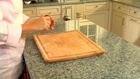 Macintosh apple being skinned and peeled rapidly with peeler Stock Footage 123732448