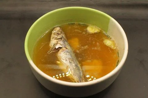 Mackerel fish in a bowl on the table. Stock Photos
