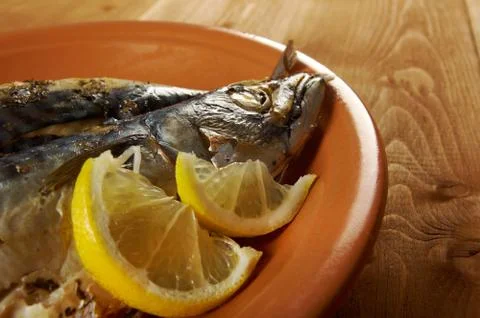 Mackerel on a grill. Stock Photos