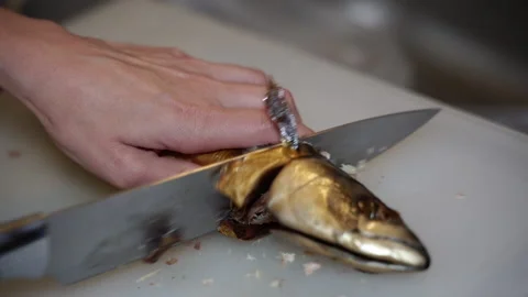 Mackerel. Mackerel fish is cut on a kitchen board. Stock Footage 236345177