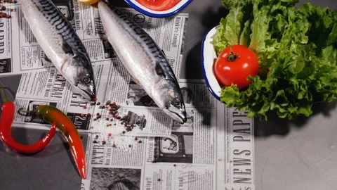Mackerel next to fresh bread, onions, pickles, tomato, herbs and pepper. Stock Footage 127960116