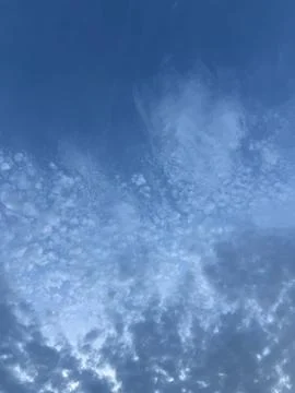 Mackerel Sky Pattern of Small Clouds in Deep Blue Stock Photos