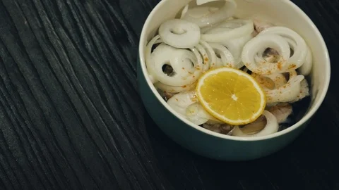 Mackerel under the onion rings in the plate Stock Footage 100975147