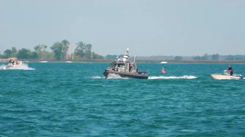Macomb County Sheriff Boat with Flashing Lights Talking to a Boat, Lake St Clair Stock Footage 343792129