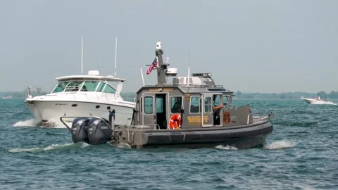 Macomb County Sheriff Boat Slow Speed, Lake St Clair Boat Traffic, Close-Up Shot Stock Footage 343792109