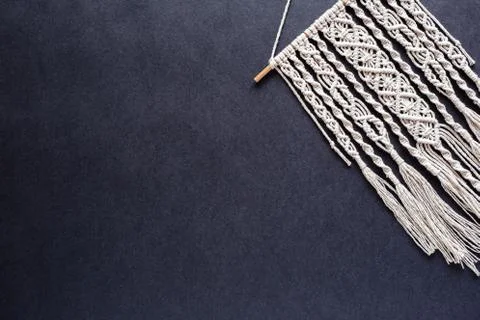 Macrame on black background, place for text, banner, flat layout, handmade, h Stock Photos