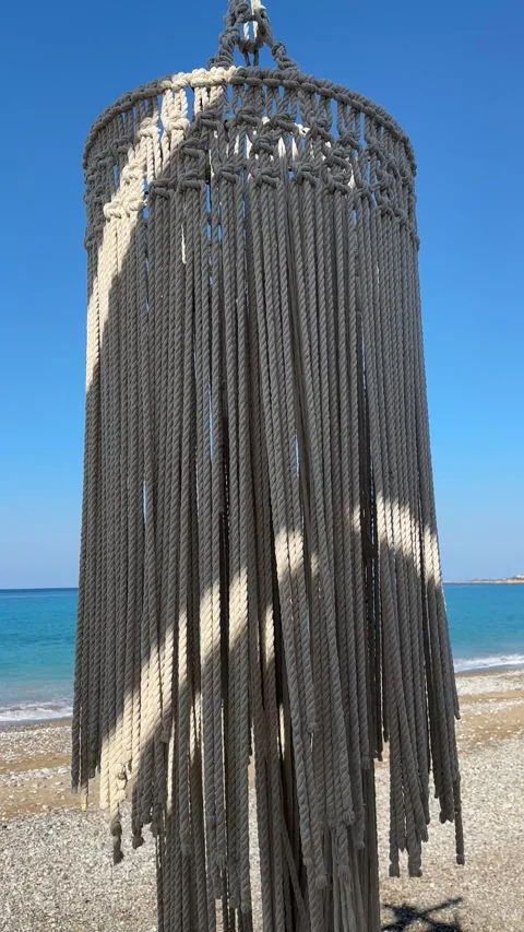 Macrame decor In Wind Near Seashore. Relax On Sea Restaurant. Trip Mood On Beach Stock Footage 252487834