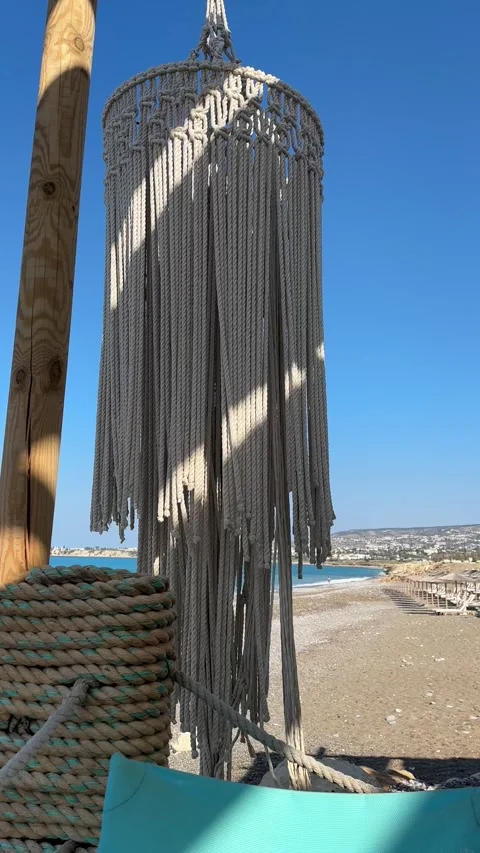 Macrame decor In Wind Near Seashore. Relax On Sea Restaurant. Trip Mood On Beach Stock Footage 252487865