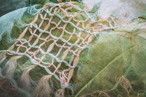 Macrame knots decorating a crumpled shawl Foto stock