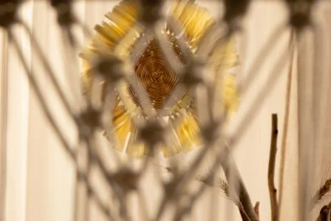 Macrame lace pattern of threads tied into knots. Light cotton ropes woven with Stock Photos