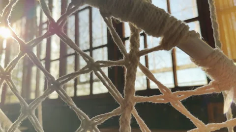 Macrame Netting Catches Warm Sunlight Indoors Against A Large Window Stockbeeldmateriaal 334121177