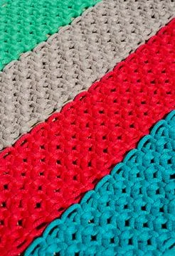 Macrame, a square knot of multi-colored threads. Stock Photos