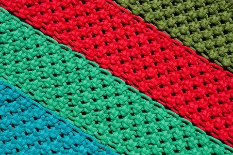 Macrame, a square knot of multi-colored threads. Stock Photos