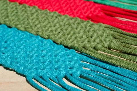 Macrame, a square knot of multi-colored threads. Stock Photos