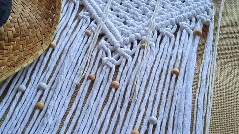 Macrame wall hanger with grain and cowboy hat, boho style. Home decor Stock Footage 202097185