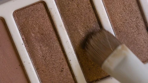 Macro 4k close up of makeup brush on an eye shadow pallete Stock Footage 121133679
