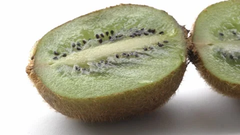Macro 4K Kiwi Cross Section With Juicy Green Flesh and Seed Pattern 스톡 동영상 348220296