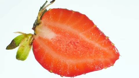 Macro 4k video of squeezing and crushing fresh ripe strawberry. Perfect abstract Stock Footage 125353937