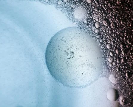 Macro abstract background of bubbles in water with oil and soap Stock Photos