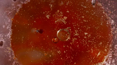 Macro abstract blood red liquid orbs background texture Video stock 130985413