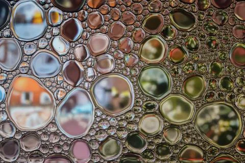 Macro abstract bubbles background. Glass surface with drops of rain. Stock Photos