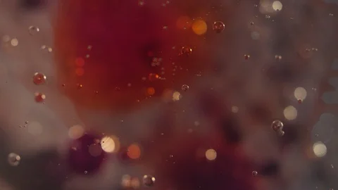 Macro abstract clear colorful bubbles with blood red liquid motion background 動画素材 118280986