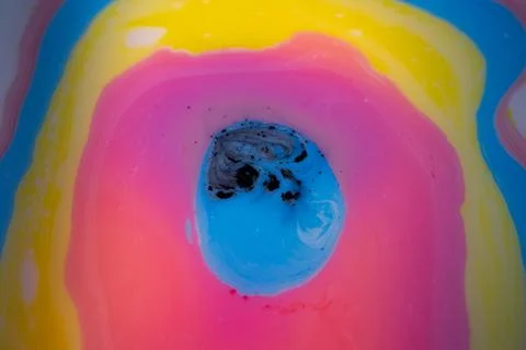 Macro abstract composition of layered liquid pigments forming curved. Foto stock