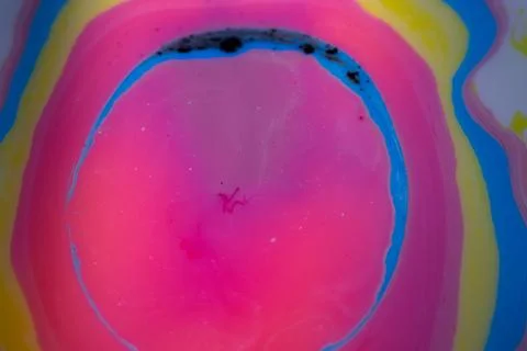 Macro abstract composition of layered liquid pigments forming curved. Stock Photos