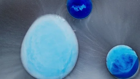 Macro abstract flow of blue alcoholic ink creating soft, fluid, and artistic Stock Footage 310666452